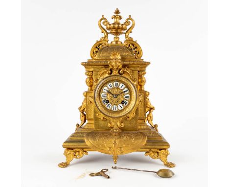 A mantle clock, Neoclassical style, gilt spelter. Second half of the 19th century.&nbsp;Dimensions:(D:13 x W:27 x H:40 cm)