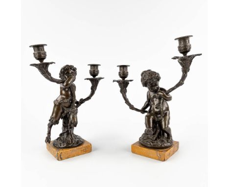 A pair of candelabra, 'Putti and a Faun', patinated bronze on a marble base, France, 19th C.&nbsp;Dimensions:(D:15 x W:27 x H