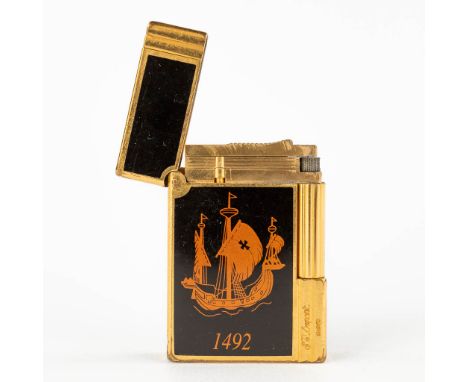 S.T Dupont, Columbus 1492, a lighter, gold-plated metal.&nbsp;In used but working condition. Without the original box.&nbsp;0