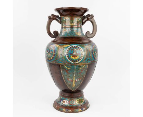 A large Oriental vase made of bronze with champselvé decor.&nbsp;Dimensions:(H:60 x D:36 cm)