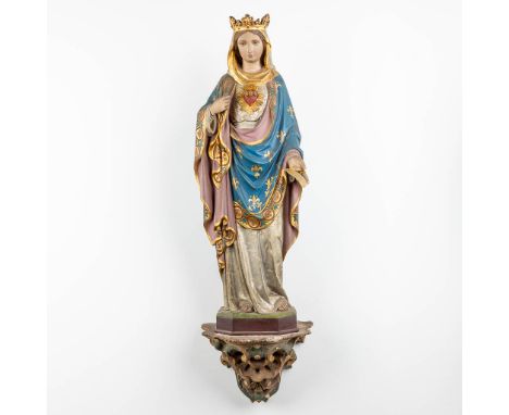 A figurine of Madonna, standing on a plaster console.&nbsp;Total height: 103 cm.&nbsp;Dimensions:(W:20 x H:83 cm)