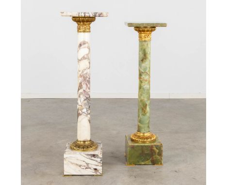 Two pedestals, marble and onyx mounted with bronze.20th century.&nbsp;Dimensions:(D:30 x W:30 x H:107 cm)Condition:Top of the