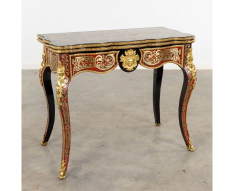 A game table, Boulle, tortoiseshell and copper inlay, Napoleon 3, 19th C.Richly decorated with gilt bronze.&nbsp;Fully restor