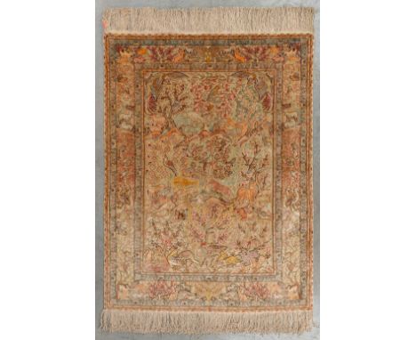 An Oriental hand-made carpet, decorated with fauna and flora. Hereke.&nbsp;Dimensions:(D:144 x W:108 cm)