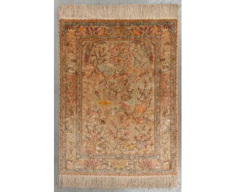 An Oriental hand-made carpet, decorated with fauna and flora. Hereke.&nbsp;Dimensions:(D:144 x W:108 cm)