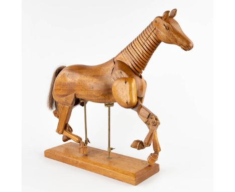 A mid-century drawing model of a horse.&nbsp;Wood with moveable limbs.&nbsp;Dimensions:(D:13 x W:53 x H:49 cm)Condition:Gener