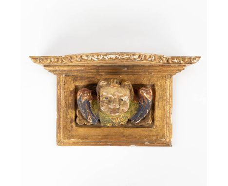 A wood-sculptured wall console with a figurine of an angel. Southern Europe.19th century.&nbsp;Dimensions:(D:13 x W:38,5 x H: