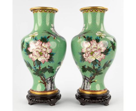 A pair of bronze vases with cloisonné enamel decor of fauna and flora.With the oirinal box.&nbsp;20th century.&nbsp;Dimension