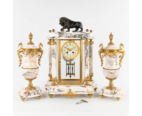 A three-piece mantle garniture portico clock and cassolettes, bronze mounted marble.Finished with a lion figurine on a ball.&