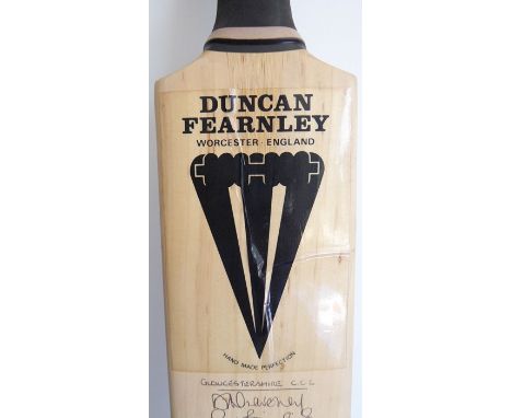 A Duncan Fernley (Worcester, England) cricket bat individually signed with the Gloucestershire C.C.C. and the Somerset C.C.C.