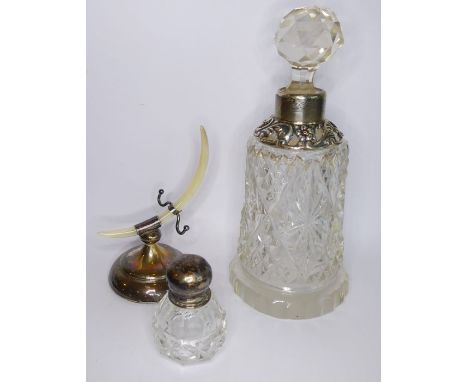 A bell-shaped silver-mounted scent bottle together with one other smaller and an early 20th century silver-mounted ring holde