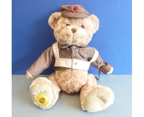 A commemorative teddy bear 'The Memory Bear' dressed in Army costume and with a central poppy on his peaked hat&nbsp;