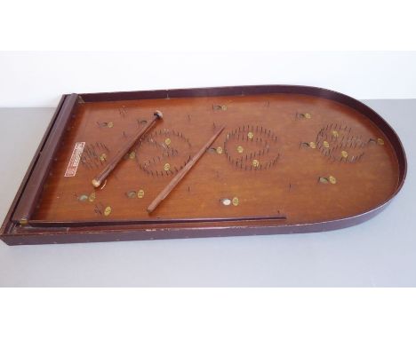 A mid 20th century&nbsp;Bagatelle board with accessories, together with a three-division metal and wickerwork bottle carrier