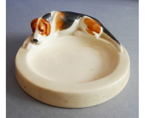 An early 20th century Royal Worcester porcelain pin tray by Doris Lindner, 'Hound'; in good overall original condition, print