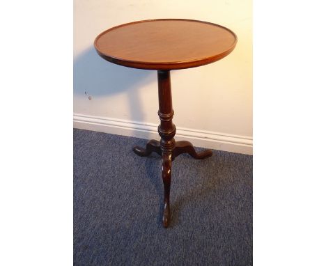 An antique circular dish-topped mahogany occasional table on tripod base for restoration (37cm diameter)