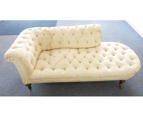 A good and large 19th century button-back cream-upholstered chaise longue; turned, tapering, fluted walnut legs terminating i
