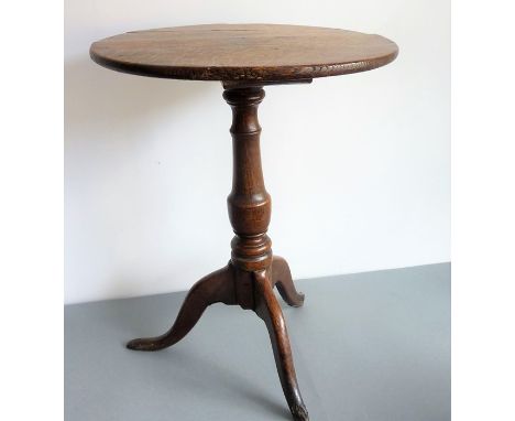 A Georgian circular-topped oak occasional table; on tripod base, for restoration