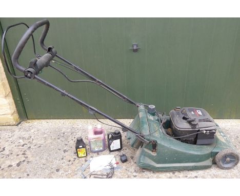 An 'Atco' Viscount 19e lawnmower and accessories to include tools, charger and oils