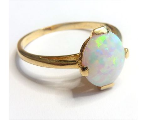 A vintage 14-carat gold ring set with a large opal(The cost of UK postage via Royal Mail Special Delivery for this lot will b