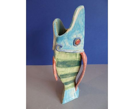 A handmade ceramic jug/vase modelled studio style in the form of a vertical open-mouthed fish, monogrammed, possibly TU (34cm