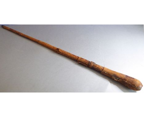 A late 19th/early 20th century leather-bound bamboo walking stick having a weighted top as a cosh