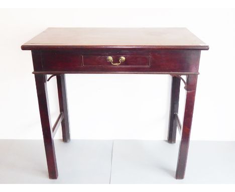 An 18th century mahogany (probably Cuban) side table; single central drawer and raised on square&nbsp;chamfered legs with Chi