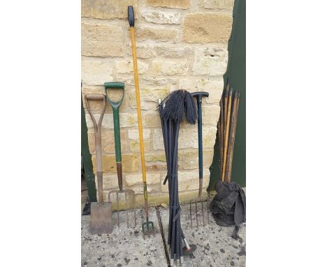 A quantity of garden tools, a set of drain rods and a set of sweep rods
