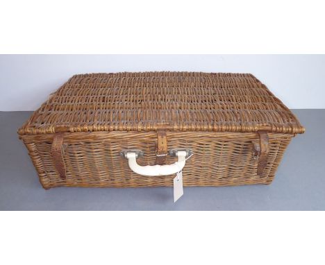 A mid-20th century wickerwork picnic basket by Brexton comprising plates, side plates, cups, saucers, thermos flasks, cutlery