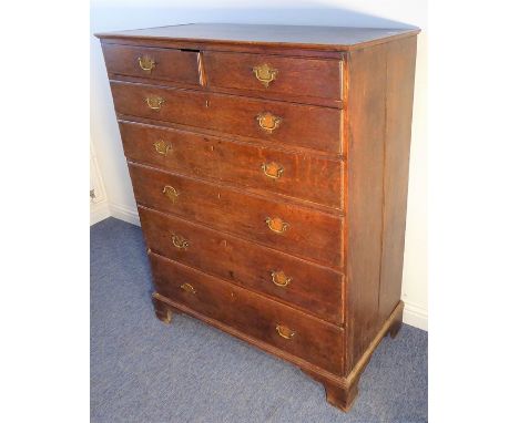 A large late 18th century George III period oak chest, two half-width unusually over five full-width graduated drawers with o