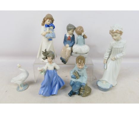 A collection of Nao and Lladro figures / groups to include goose, children with animals and similar, largest approximately 28