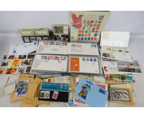 Philately - Lot to include a binder of first day covers, loose GB and world stamps and a small quantity of mint stamps. [W]