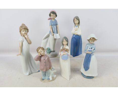A collection of Nao figures / groups to include children with toys, young girl with a puppy and similar, largest approximatel