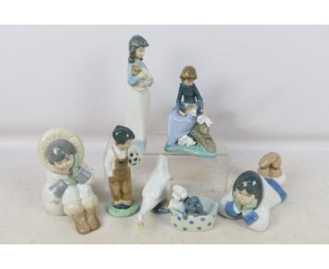A collection of Nao figures / groups to include Eskimo children, young girl with a puppy , girl with rabbits and similar, lar