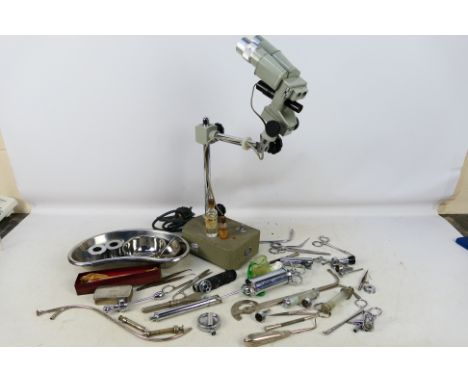 A collection of medical equipment and a Griffin BM1 stereo microscope. [W]