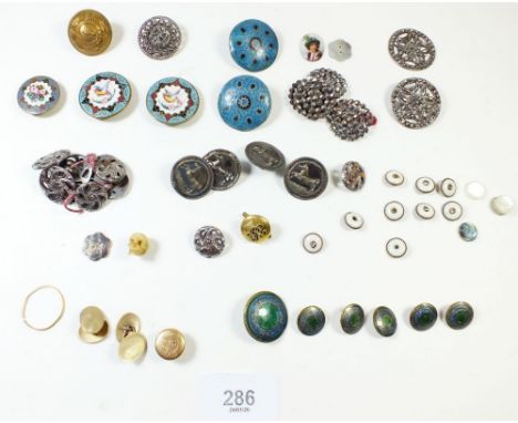 A good group of antique enamel and white metal studs and buttons including unusual ivory skull form miniature stud