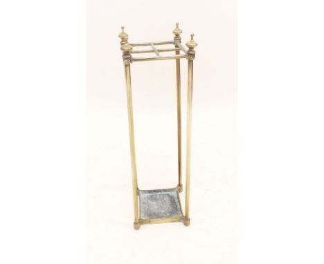 An Edwardian brass four section stick stand