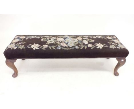 A tapestry topped long footstool