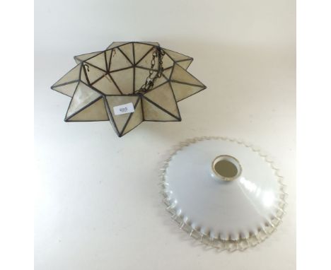 An opaque glass frilled lamp shade and a shell lampshade