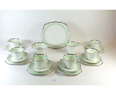 A Bell China Art Deco tea service with green and silvered banded decoration comprising: six cups and saucers and side plates,