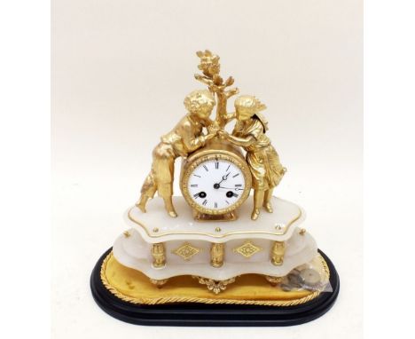 A French alabaster and gilt metal mantel clock with boy and girl to top