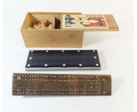 A brass trench art cribbage board engraved 'SS Cape Nelson' another cribbage board and a chess set