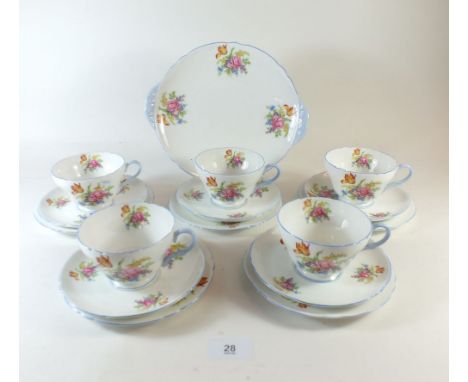 A Shelley floral printed vintage tea service comprising five cups and saucers, six tea plates, and cake plate