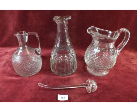 A Victorian cut glass table carafe and decanter jug (no stopper), and a 19th century glass ladle with engraved vine decoratio