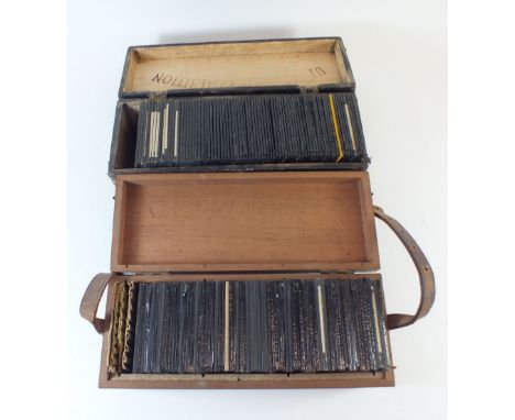 Two cases of magic lantern glass slides including views from around 1945 church mission ground, Gambia and other parts of Afr