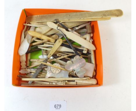 A small box of miscellaneous 19th century small ivory and mother of pearl items - including button hooks, manicure implements