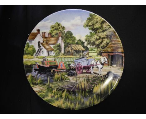 A box of collectible plates to include Royal Worcester.