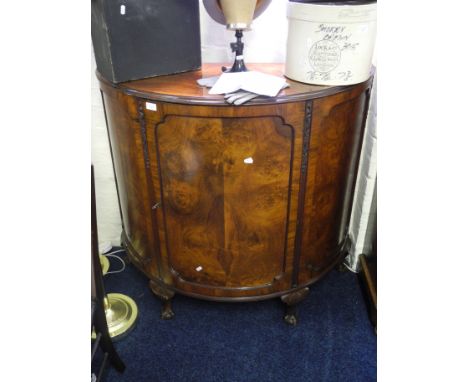 A bow fronted walnut cocktail cabinet.