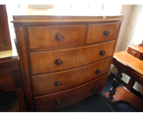 A Victorian mahogany bow fronted chest with three long, two short drawers.