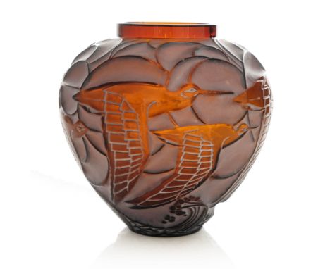 Rene Lalique, a Courlis dark amber glass vase, model 1085, designed circa 1931, white staining, etched mark R Lalique France,