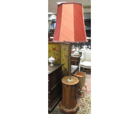 A pair of brass and leather lamp standards with column bases (2), (215cm with shades)  